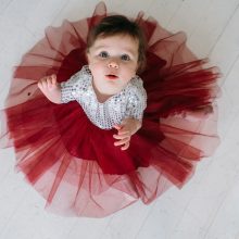 A baby girl dressed in a pink tutu, radiating joy and elegance