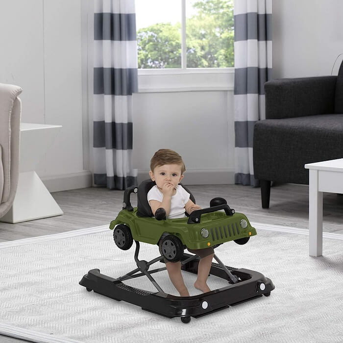 Photo of a happy baby safely using a baby walker on a carpeted surface, under the supervision of a caregiver
